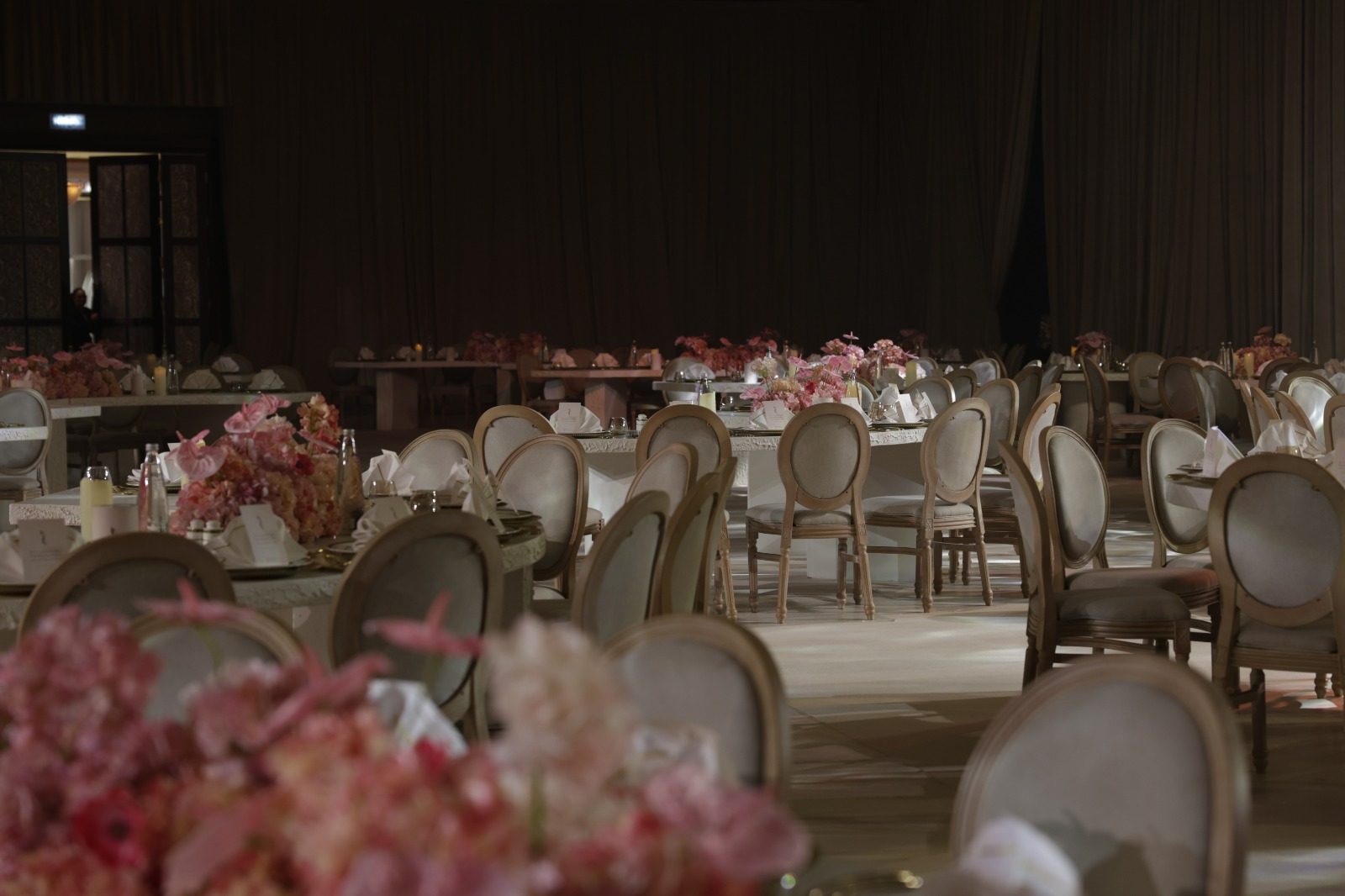 Guest seating with blush centrepieces